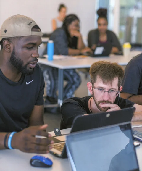 Andrew Judd, full-stack developer, coding with coffee at a community meetup
